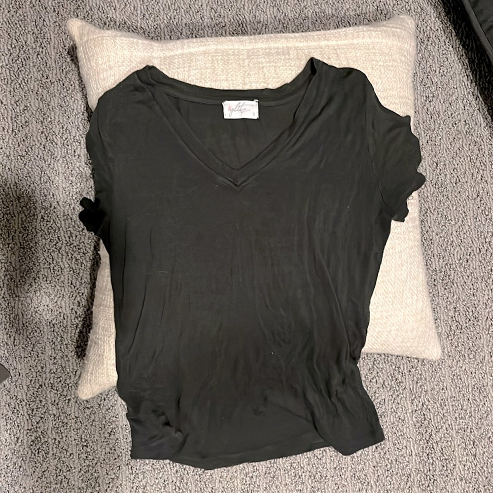 Stylish dark green shirt w cut out shoulders.